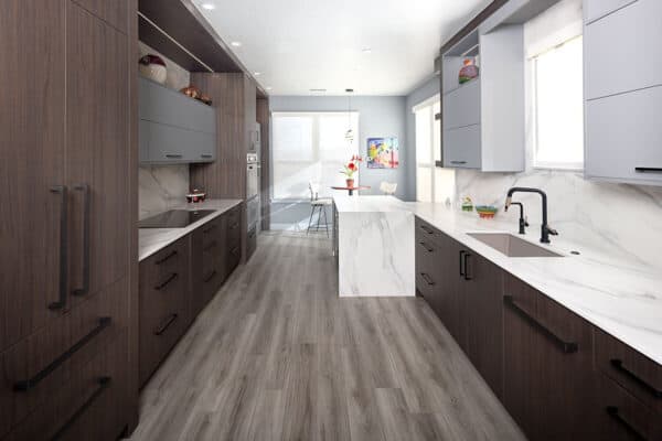 view from dining area into kitchen with modern cabinets and hardware, plus plenty of counterspace ONE Residential Builders Denver