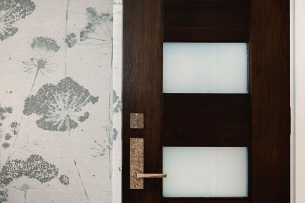 contemporary door with dark wood and four glass panels covered by privacy film ONE Residential Builders Denver