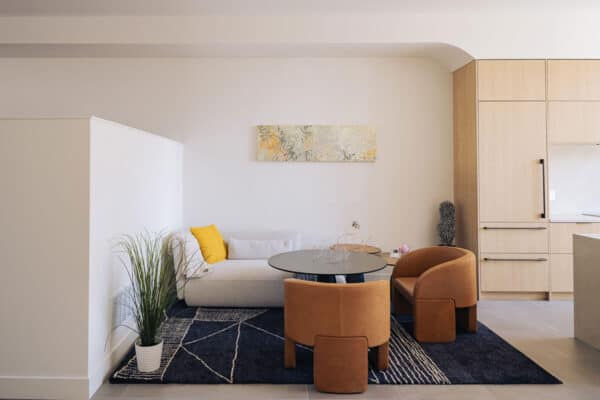 contemporary home with sitting area next to open concept kitchen ONE Residential Builders Denver