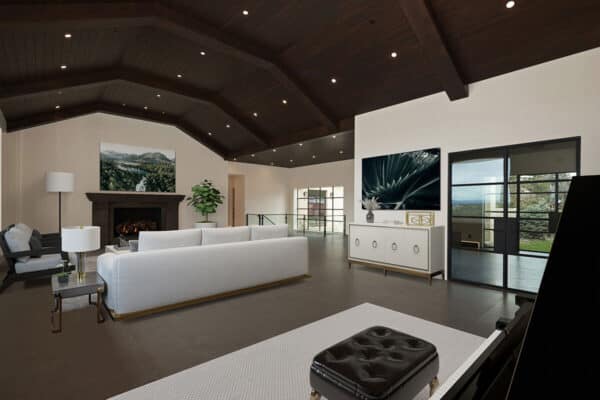 traditional meets modern in this living room with dark panel wood ceiling with off-white furniture ONE Residential Builders Denver
