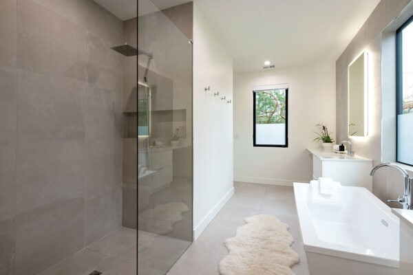 new bathroom with modern fixtures, white sink and tub ONE Residential Builders Denver